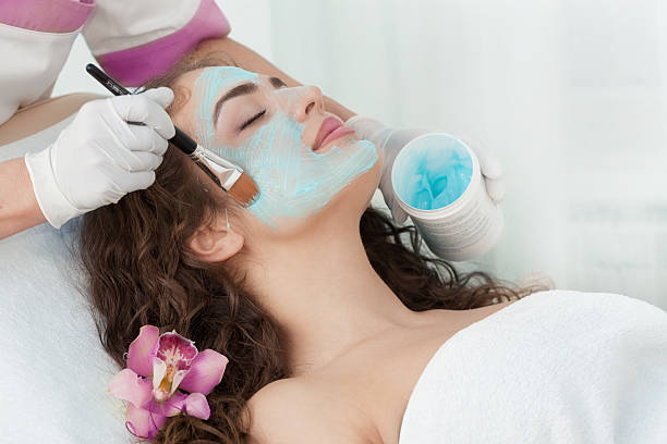 istock Young Beautiful Relaxing Woman Having Moistening Mask Applied 529316193