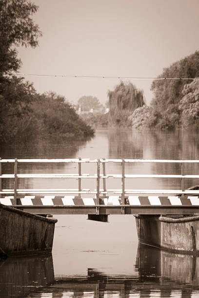 istock old floating bridge in Italy 529325289