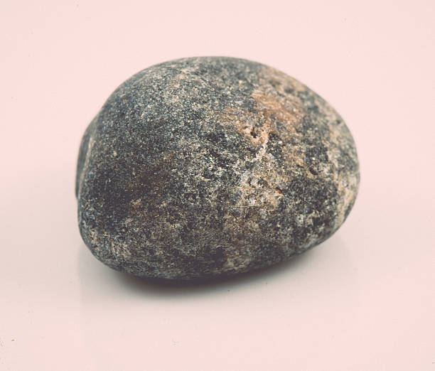 istock single stone isolated on white background. vintage 529326627