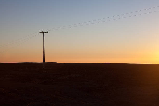 istock power pole in the desert 529329147