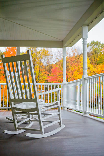 istock Rocking chairs on a porch in Autumn 529329879
