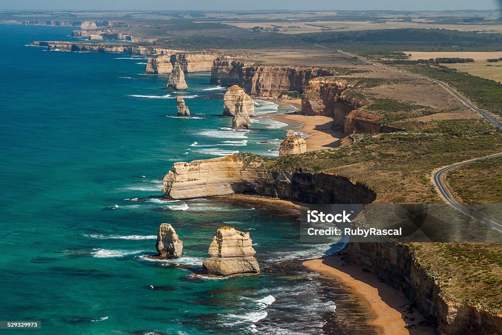 The Twelve Apostles and Great Ocean Road from the air Aerial view of the Twelve Apostles, Great Ocean Road, Victoria, Australia. Great Ocean Road Stock Photo