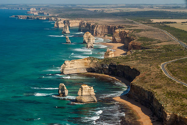 The Twelve Apostles and Great Ocean Road from the air Aerial view of the Twelve Apostles, Great Ocean Road, Victoria, Australia. great ocean road photos stock pictures, royalty-free photos & images
