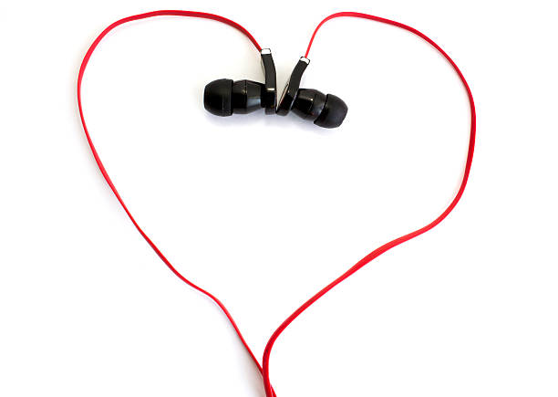 istock red earphone setting in heart shape on white background 529351051
