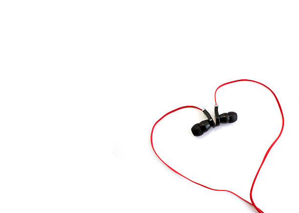 istock red earphone setting in heart shape and spacing for caption 529351055