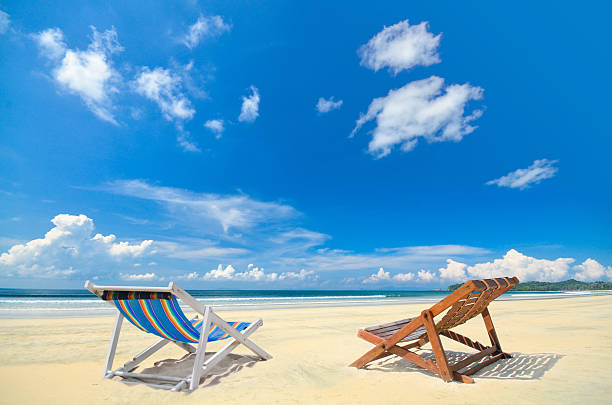 istock Chair under blue cloudy sky at koh Payam , Ranong , Thailand 529353077