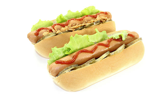 istock Hot dogs with ketchup, pickle and fried onions 529355161