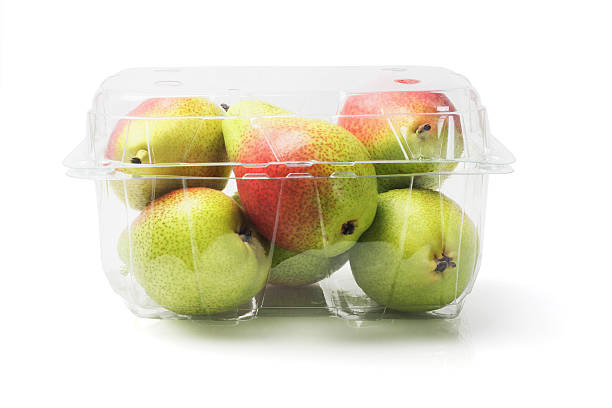 Blush Pears In Plastic Container Fresh Blush Pears In Plastic Container On White Background forelle pear stock pictures, royalty-free photos & images