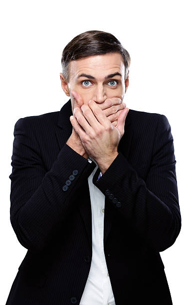 istock Businessman covering his mouth 529365659
