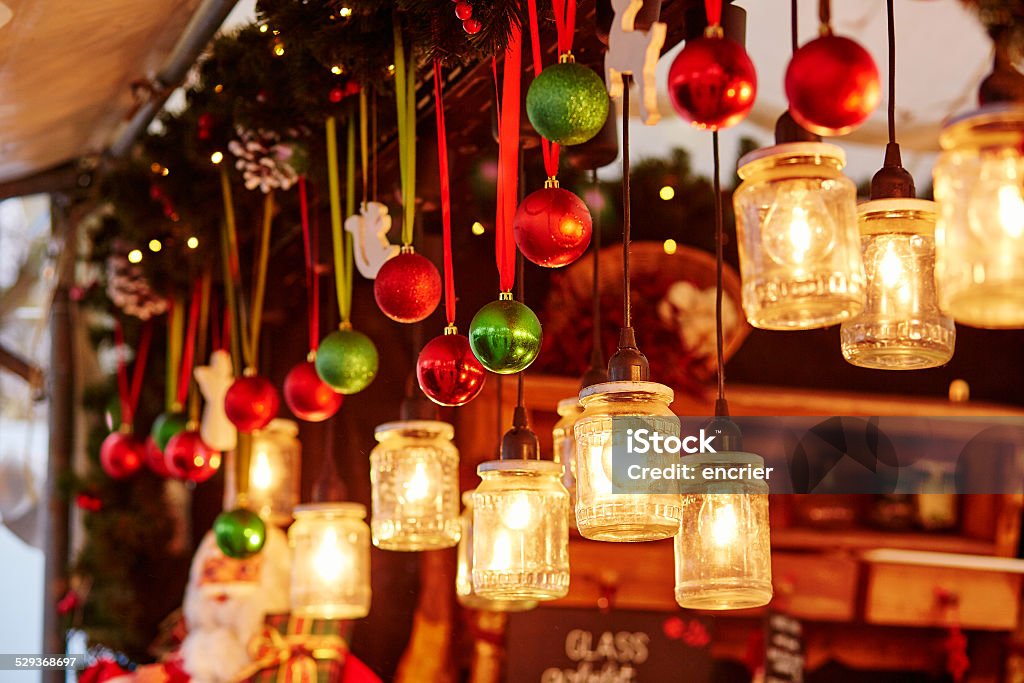 Decorations on a Parisian Christmas market Colorful Christmas decorations and glass lanterns on a Parisian Christmas market Christmas Market Stock Photo