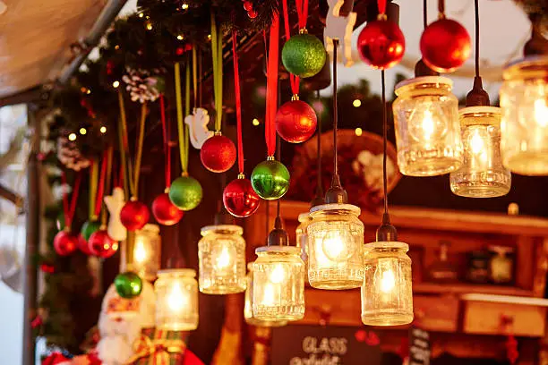 Colorful Christmas decorations and glass lanterns on a Parisian Christmas market