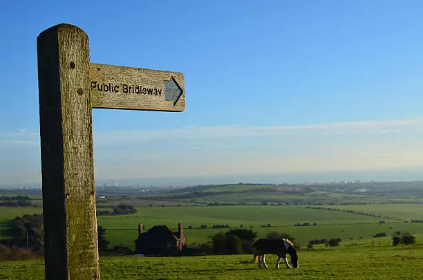 Public bridleway sign on the top of Devil's Dyke in East Sussex, England. Image taken mid December 2014 using a Nikon D5100 with prime lens.