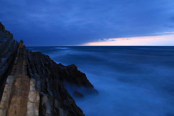 Cliffs of Biscay Mass of water whipping the rocks of the coast of Biscay. sopelana stock pictures, royalty-free photos & images