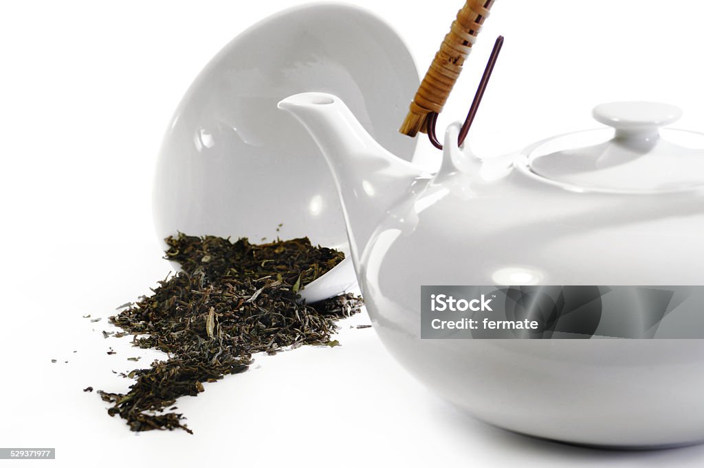 Teaware white in white and some loose tea Teaware white in white like clinical, and some loose tea, nearly monochrome, cool, clean, medical style Chinese Herbal Medicine Stock Photo