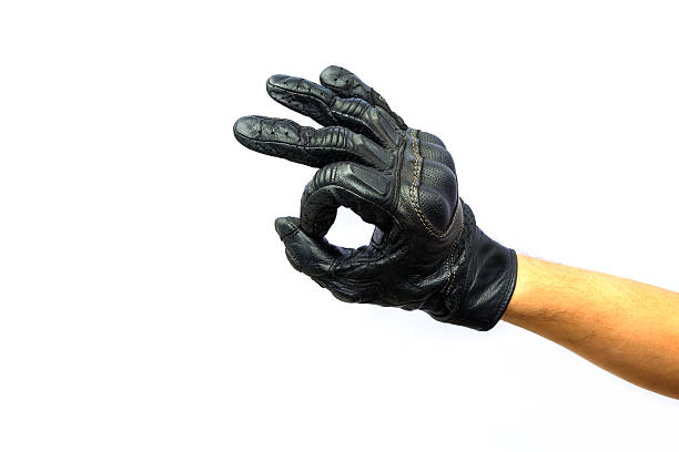 istock Hand ok sign in black leather glove 529382111