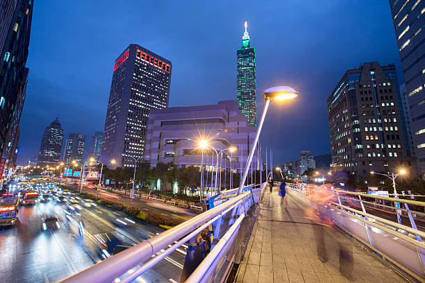 istock Commuters walking on a rainy Taipei 529382737