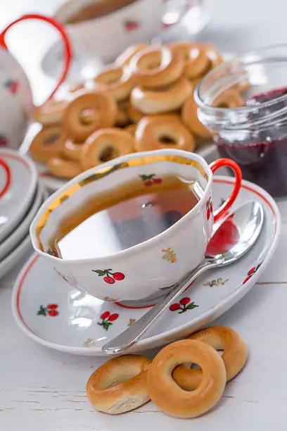 Russian tea party - black tea, ring-shaped bread, jam