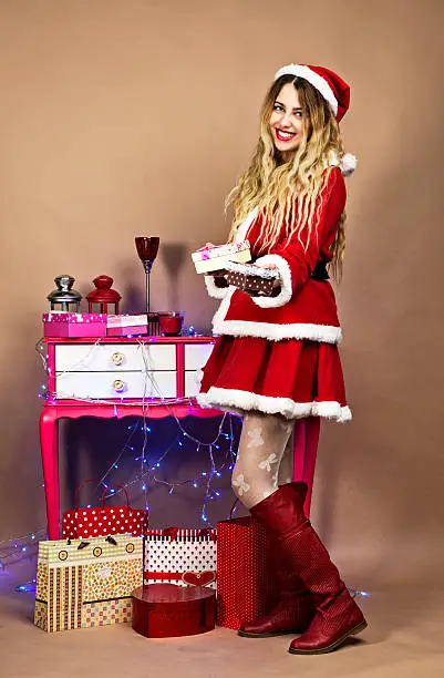Happy Mrs.Claus giving gift box for you