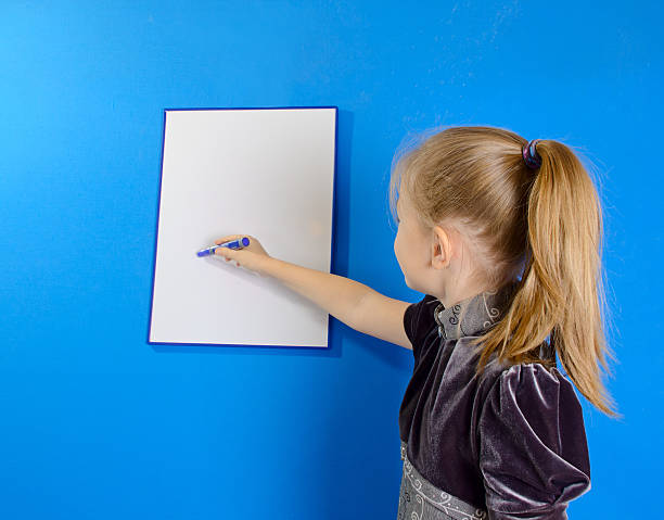 istock the girl draws on a white plastic board 529385531