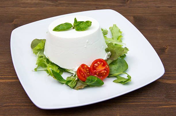 istock Ricotta on dish on wood 529385851