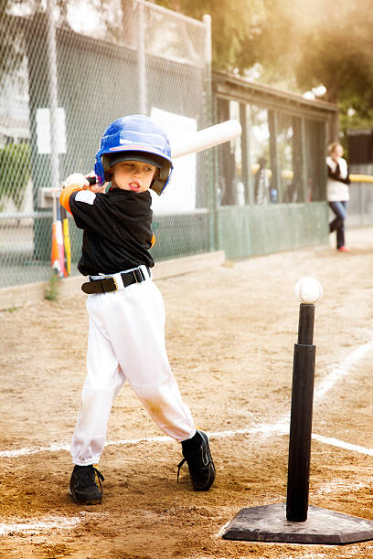 istock Little boy practicing baseball swing at T-Ball 529397500