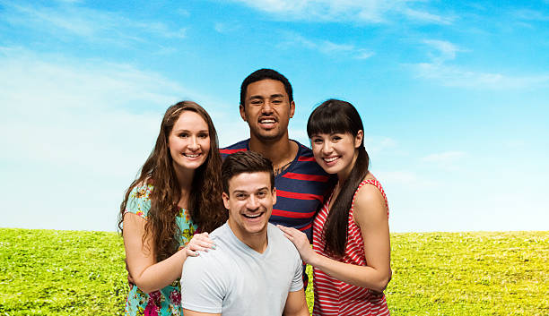istock Happy four friends standing outdoors 529402034