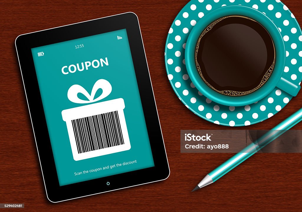 tablet with discount coupon and  cup of coffee tablet with discount coupon and  cup of coffee lying on wooden desk. Bar code is designed and generated by author Autumn Stock Photo