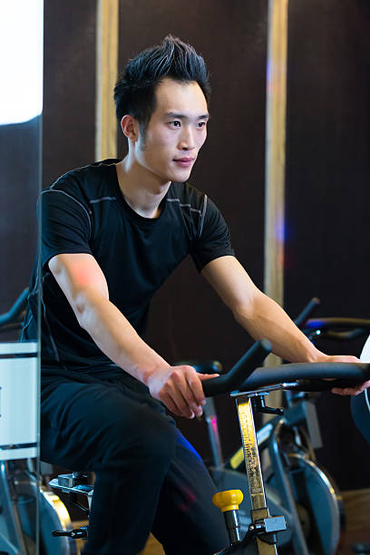 istock young asian people working out in modern gym 529403260