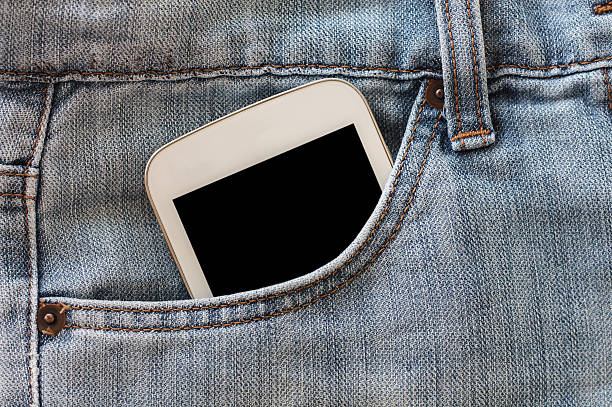istock mobile phone in jeans pocket with black screen 529403610