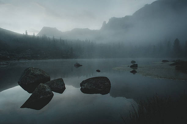 istock Morning mist lake. Mystical atmosphere before sunrise. Mountains background 529404760