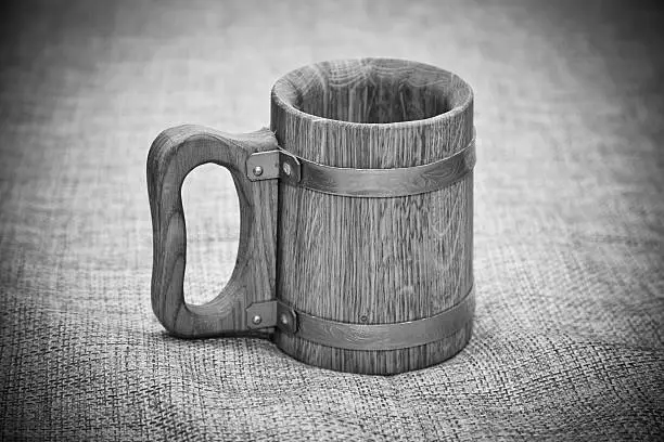 Old wooden mug. Black and white photo