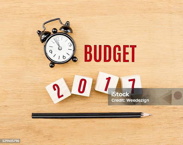 Budget 2017 Year On Cube With Pencil And Clock Stock Photo - Download Image Now - 2017, Alarm Clock, Balance