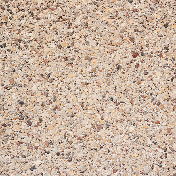istock Cement with pebbles stones fragment 529408312