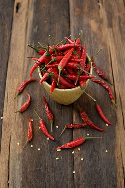 istock Red chili peppers in a cup 529408428
