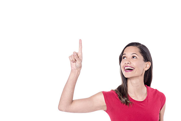 istock Woman pointing up, isolated on white 529413684