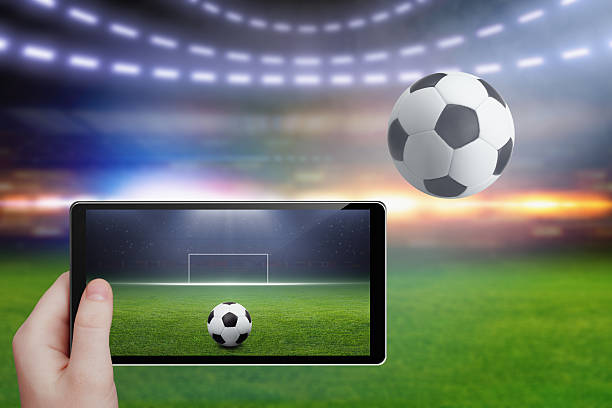 istock Tablet in hand, soccer stadium 529415220