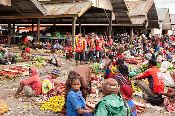 Indonesia. People are at the lokal market of Wamena. Wamena,  Indonesia - January 9, 2010: Wamena,  Indonesia. People are at the lokal market of Wamena in Baliem Valley,  Papua New Guinea dani stock pictures, royalty-free photos & images