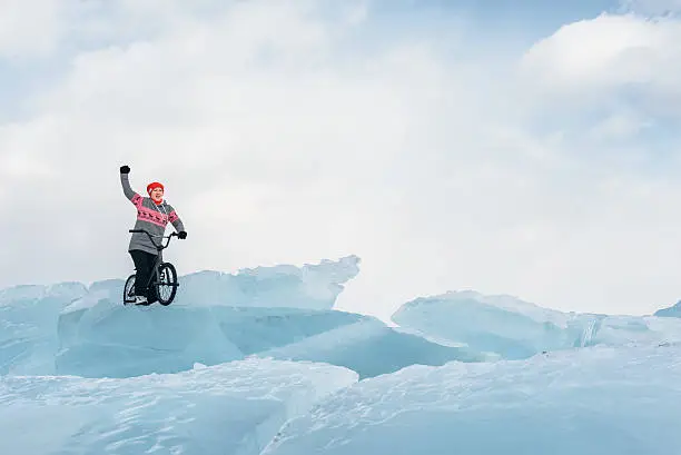 Photo of Girl on a bmx on ice.