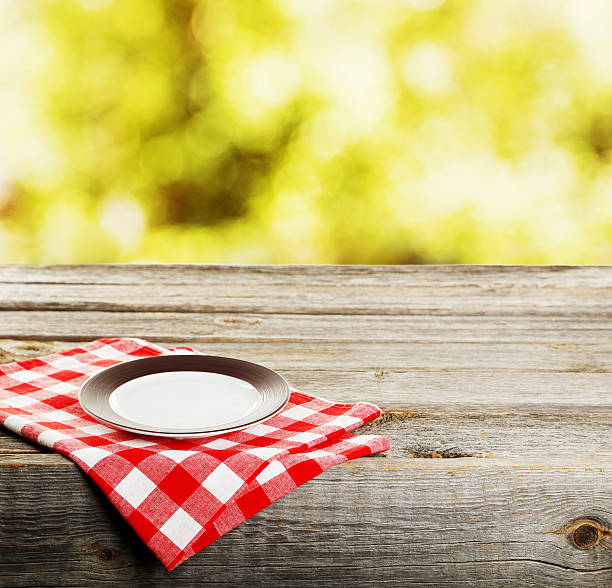 istock Background with wooden table with white plate 529415892