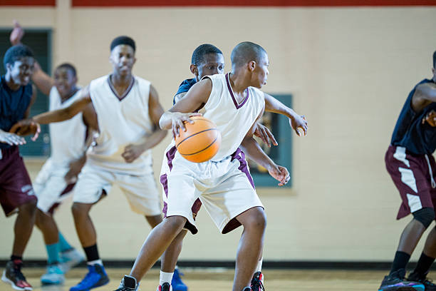 istock Dribbling a Ball up the Court 529416094