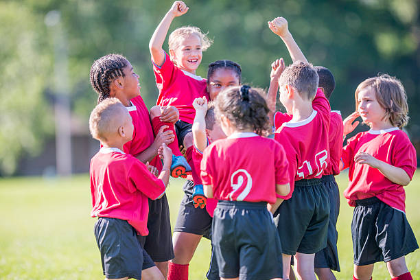 istock Holding a Teammate Up in the Air 529416418
