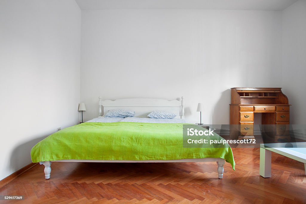 Rustic bedroom Rustic bedroom with parquet flooring. Bed - Furniture Stock Photo