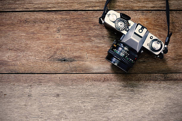 istock Vintage camera on wooden background and copy space 529419138