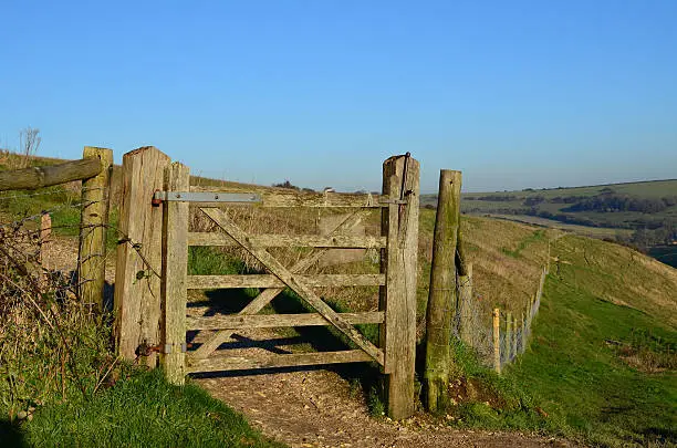 Public footpath and gate on the Sussex Southdowns in England. Image taken in late Autumn using Nikon D5100 and prime lens.