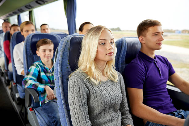 istock happy couple or passengers in travel bus 529421464