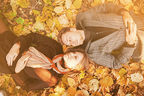 istock Loving couple rests in autumn park 529421967