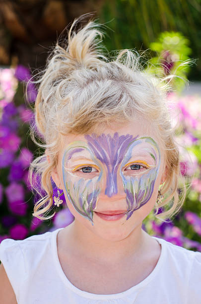 istock girl with face painting 529422249