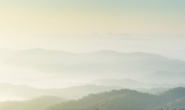 istock Misty layered mountains in sunrise 529422537