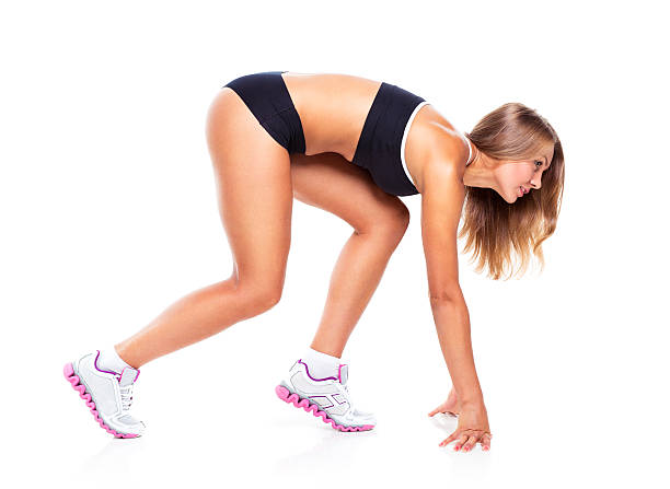 istock Young sports girl does exercises on a white 529423391