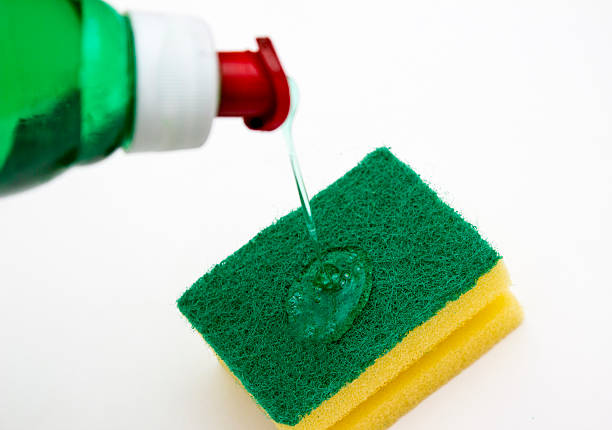 istock Dishwashing liquid pouring over dish sponge 529424048